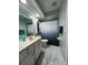 Full bathroom featuring gray paint, white tile floor, toilet and shower at 9850 Sw 191St Ave, Dunnellon, FL 34432