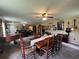 Open floor plan, dining area has large wooden table at 9850 Sw 191St Ave, Dunnellon, FL 34432