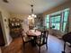 Charming dining area with wood floors, bright windows, and classic decor at 9850 Sw 191St Ave, Dunnellon, FL 34432