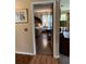 The main bedroom features hardwood floors, vintage decor, and bright windows at 9850 Sw 191St Ave, Dunnellon, FL 34432
