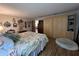 Well lit main bedroom featuring a large bed and ample storage at 9850 Sw 191St Ave, Dunnellon, FL 34432