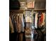 Spacious walk-in closet with wooden shelving and ample storage for clothes and accessories at 9850 Sw 191St Ave, Dunnellon, FL 34432