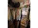 Spacious walk-in closet with wooden shelving and ample storage for clothes and accessories at 9850 Sw 191St Ave, Dunnellon, FL 34432