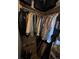 Walk-in closet featuring clothing racks and wooden shelves with overhead storage at 9850 Sw 191St Ave, Dunnellon, FL 34432
