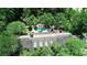 Aerial view of a home with a pool, spa, and mature trees surrounding the property at 1300 Sw 43Rd Pl, Ocala, FL 34471