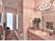 Elegant bathroom featuring a walk-in shower, sink with mirror, and classic decor at 1300 Sw 43Rd Pl, Ocala, FL 34471