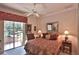 Cozy bedroom with a large window, decorative accents, and a comfortable bed at 1300 Sw 43Rd Pl, Ocala, FL 34471