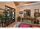 Elegant foyer featuring decorative ceilings, chandelier lighting, and a patterned tile floor at 1300 Sw 43Rd Pl, Ocala, FL 34471