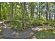 Picturesque garden path winding through lush greenery with brick-lined borders at 1300 Sw 43Rd Pl, Ocala, FL 34471