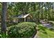 A charming guest house with a screened-in porch nestled among mature trees and lush landscaping at 1300 Sw 43Rd Pl, Ocala, FL 34471