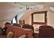 Home theater boasting a large screen, projector, comfortable leather seating, and a cozy ambiance at 1300 Sw 43Rd Pl, Ocala, FL 34471
