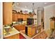 Gourmet kitchen featuring custom cabinetry, granite island, and state-of-the-art stainless steel appliances at 1300 Sw 43Rd Pl, Ocala, FL 34471