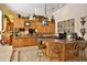 Spacious kitchen with custom cabinets, granite countertops, and a large island with bar seating at 1300 Sw 43Rd Pl, Ocala, FL 34471