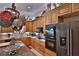 Modern kitchen with stainless steel appliances, custom cabinets, and a functional center island at 1300 Sw 43Rd Pl, Ocala, FL 34471