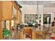 Elegant kitchen area with counter seating, granite countertops, custom cabinets, and modern appliances at 1300 Sw 43Rd Pl, Ocala, FL 34471