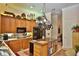 Gourmet kitchen featuring custom cabinetry, stainless appliances, and a functional center island at 1300 Sw 43Rd Pl, Ocala, FL 34471