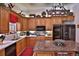 Well-lit kitchen featuring granite countertops, stainless steel appliances, and custom cabinets at 1300 Sw 43Rd Pl, Ocala, FL 34471