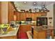 Well-equipped kitchen with stainless steel appliances, custom cabinetry, and a functional center island at 1300 Sw 43Rd Pl, Ocala, FL 34471