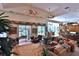 Open-concept living area with direct backyard access, ceiling fans, and an open floorplan at 1300 Sw 43Rd Pl, Ocala, FL 34471