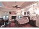 Beautiful main bedroom with a fireplace, a ceiling fan, hardwood floors, and lots of light at 1300 Sw 43Rd Pl, Ocala, FL 34471