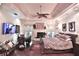 Elegant main bedroom with hardwood floors, a fireplace, a sitting area, and a ceiling fan at 1300 Sw 43Rd Pl, Ocala, FL 34471