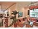Bright sitting area with comfortable seating, a large window overlooking the property, and stylish décor at 1300 Sw 43Rd Pl, Ocala, FL 34471