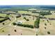 Aerial shot of a well-planned community with custom homes nestled among mature trees and lush greenery at 0000 Se 116Th Place Rd, Ocala, FL 34480