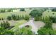 Long driveway to grand entrance with mature landscaping at 0000 Se 116Th Place Rd, Ocala, FL 34480