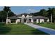 Elegant single-story home with modern architectural details, professional landscaping, and a spacious driveway at 0000 Se 116Th Place Rd, Ocala, FL 34480