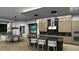 Open-concept kitchen and dining area with a large island, modern lighting, and stylish decor at 0000 Se 116Th Place Rd, Ocala, FL 34480
