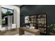 Modern office with a large window, custom shelving, and stylish decor, perfect for work or study at 0000 Se 116Th Place Rd, Ocala, FL 34480