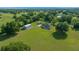 Expansive aerial view of a sprawling home, showcasing its generous lot and accessory building at 1058 Se 59Th St, Ocala, FL 34480
