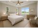 Inviting bedroom featuring a tray ceiling, large windows, and neutral decor at 1058 Se 59Th St, Ocala, FL 34480