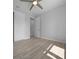 Bedroom features two closets, wood-look floors and neutral paint at 1058 Se 59Th St, Ocala, FL 34480