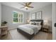 Beautifully staged bedroom featuring a ceiling fan and natural light at 1058 Se 59Th St, Ocala, FL 34480