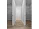 Walk-in closet with wire shelving and light wood floors at 1058 Se 59Th St, Ocala, FL 34480