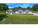 Attractive one-story home boasting a stone accent facade and a lush green lawn at 1058 Se 59Th St, Ocala, FL 34480