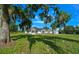 Picturesque home with stone accents on a large lot, shaded by mature trees at 1058 Se 59Th St, Ocala, FL 34480