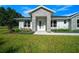 Charming one-story home featuring a stone facade and a neatly manicured lawn at 1058 Se 59Th St, Ocala, FL 34480