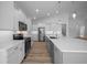Bright, modern kitchen with stainless steel appliances, white cabinets, and a spacious center island at 1058 Se 59Th St, Ocala, FL 34480