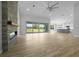 Bright, open living room with a stone fireplace and sliding glass doors to the backyard at 1058 Se 59Th St, Ocala, FL 34480