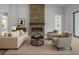 Inviting living room featuring a stone fireplace, comfortable seating, and stylish decor at 1058 Se 59Th St, Ocala, FL 34480