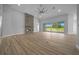 Living room with a stone fireplace and glass sliding doors to an outdoor space at 1058 Se 59Th St, Ocala, FL 34480
