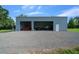 Exterior features a metal outbuilding with an open bay at 1058 Se 59Th St, Ocala, FL 34480