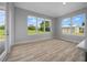Bright room with large windows providing scenic outdoor views and lots of natural light at 1058 Se 59Th St, Ocala, FL 34480