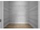 Spacious walk-in closet with multiple shelves and hanging rods for optimal organization at 1058 Se 59Th St, Ocala, FL 34480