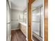 Bathroom with double vanity, shower, and wood cabinetry at 10739 Se 44Th Ter, Belleview, FL 34420