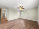Spacious bedroom with neutral walls, laminate flooring, ceiling fan, and ample natural light at 10739 Se 44Th Ter, Belleview, FL 34420