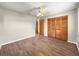 Spacious bedroom with wood-look floors and large closet with louvered doors at 10739 Se 44Th Ter, Belleview, FL 34420