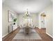 Elegant dining room with stylish decor, chandelier lighting, and access to a patio for a luxurious dining experience at 10739 Se 44Th Ter, Belleview, FL 34420